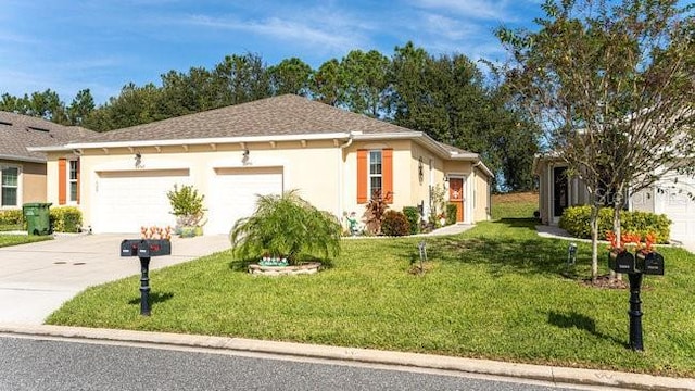 view of front of home featuring a front lawn, concrete driveway, an attached garage, and stucco siding