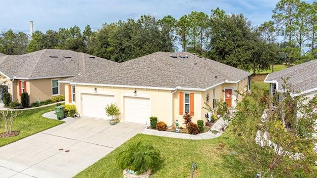 single story home with driveway, stucco siding, an attached garage, and a front yard