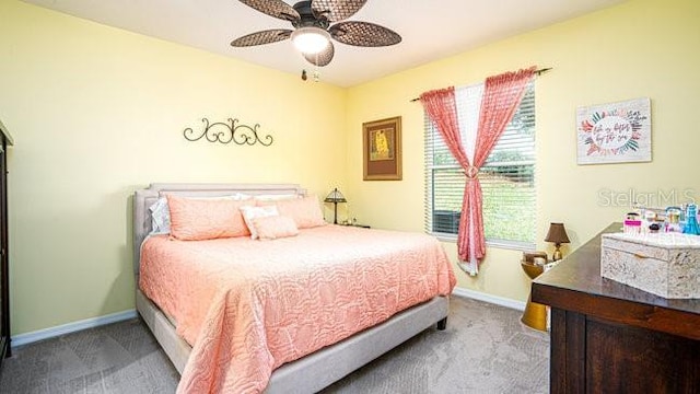 bedroom featuring ceiling fan, carpet flooring, and baseboards