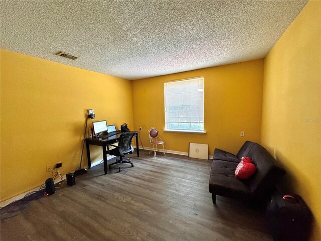 office space featuring dark hardwood / wood-style flooring and a textured ceiling