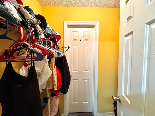 mudroom featuring a textured ceiling