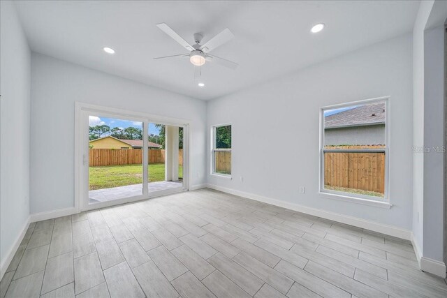 unfurnished room with ceiling fan and light hardwood / wood-style flooring