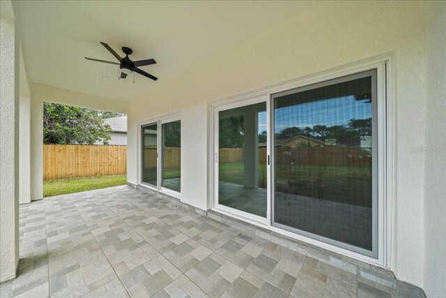 view of patio / terrace featuring ceiling fan