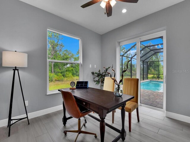 dining area featuring light hardwood / wood-style flooring and ceiling fan