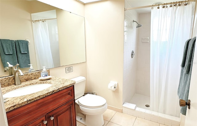 bathroom featuring curtained shower, tile patterned flooring, toilet, and vanity