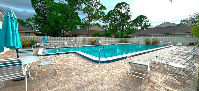 view of swimming pool with a patio