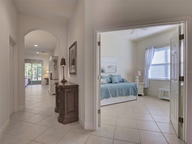 bedroom featuring light tile patterned floors and ceiling fan