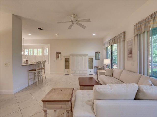 living room featuring light tile patterned floors, visible vents, ceiling fan, and recessed lighting