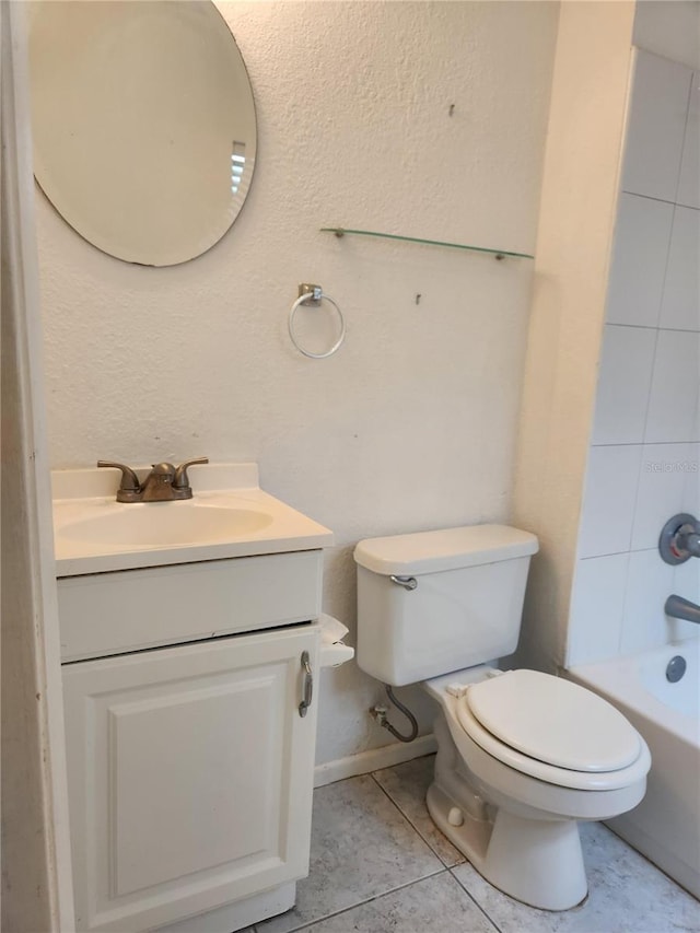 full bathroom with tile patterned floors, vanity, toilet, and tiled shower / bath combo