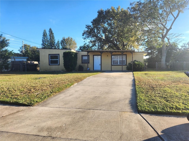 single story home featuring a front yard