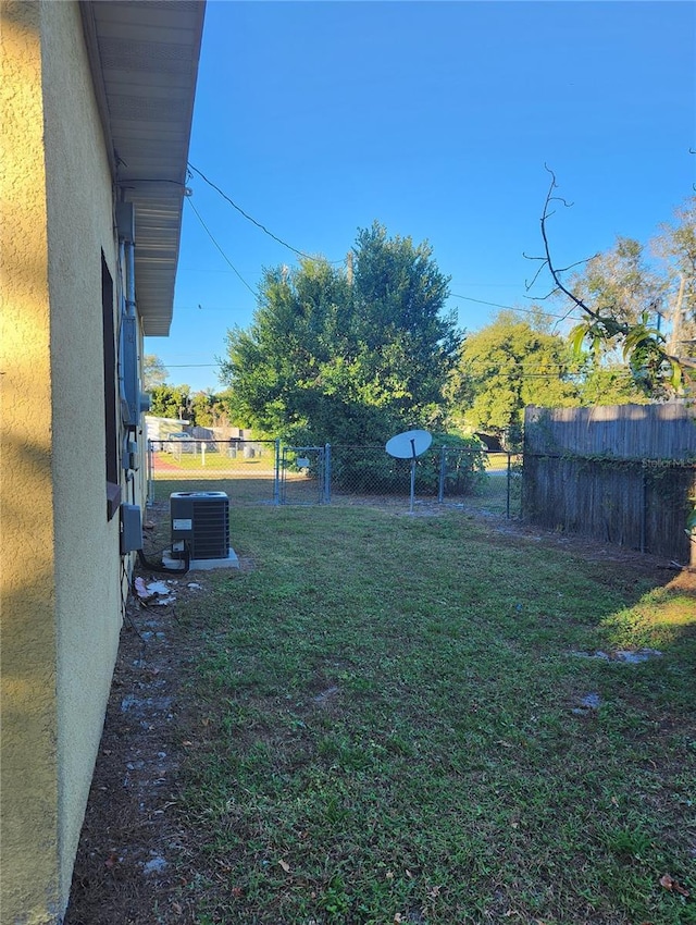 view of yard featuring central AC