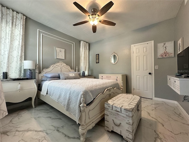 bedroom featuring a textured ceiling and ceiling fan