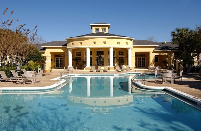 view of swimming pool with a patio area