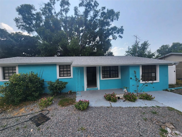 single story home featuring stucco siding