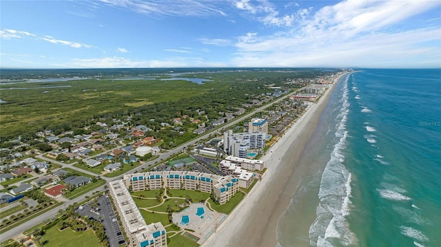 drone / aerial view featuring a view of the beach and a water view