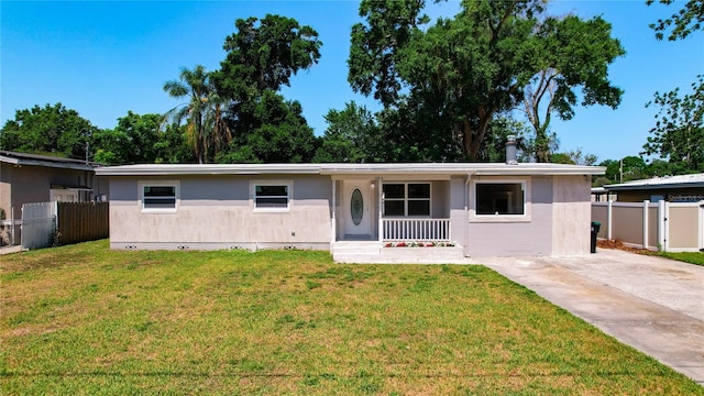 single story home with covered porch and a front lawn