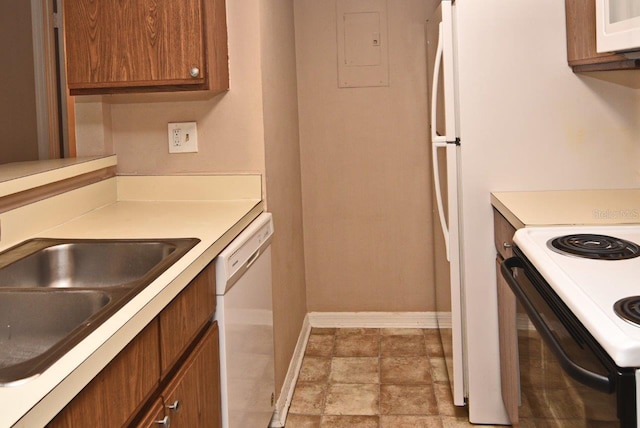 kitchen featuring white appliances and sink