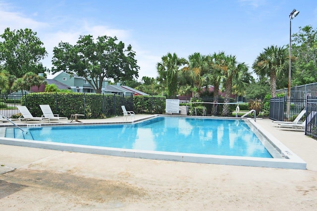 view of swimming pool featuring a patio