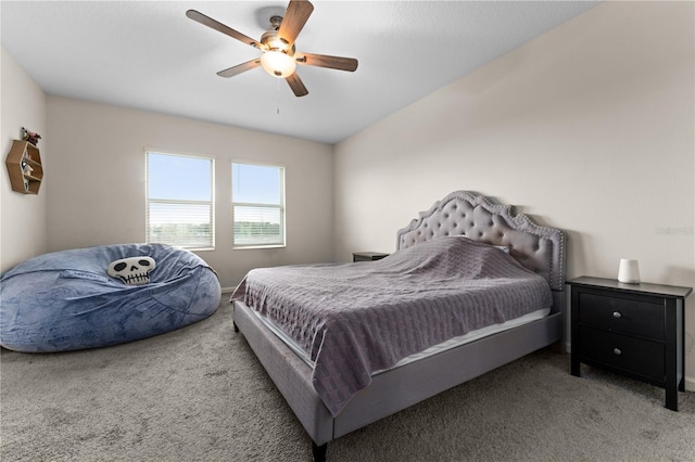 bedroom with lofted ceiling, ceiling fan, and carpet floors