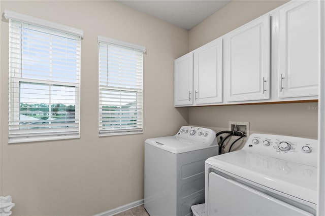 laundry area featuring cabinets and separate washer and dryer