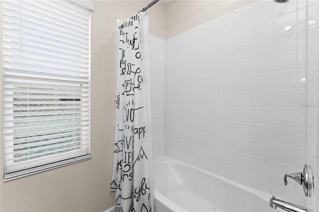 bathroom featuring shower / bath combo with shower curtain