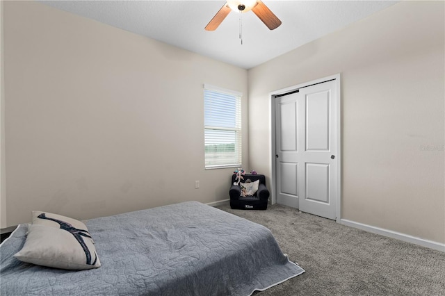 bedroom with ceiling fan and light carpet