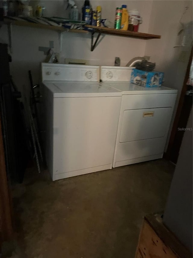 washroom with washer and dryer