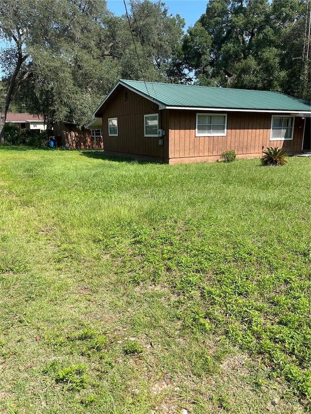 exterior space featuring a front lawn