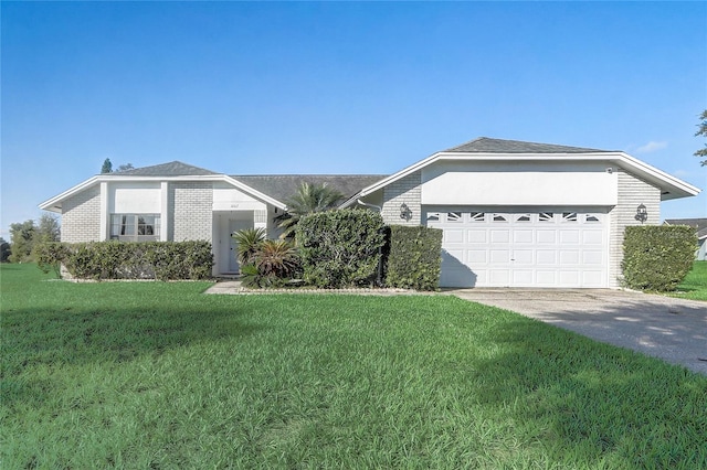 ranch-style home featuring a garage and a front lawn