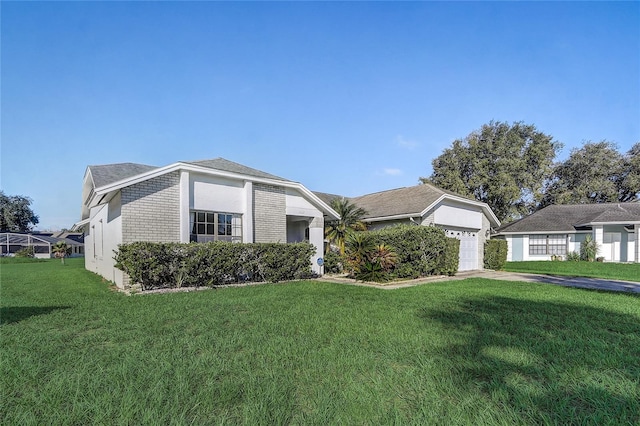 view of front of property featuring a garage and a front yard