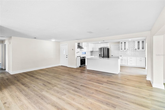 unfurnished living room with light hardwood / wood-style flooring