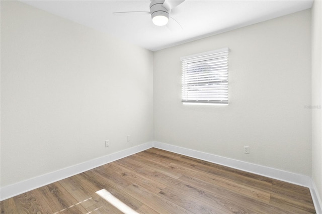 unfurnished room featuring hardwood / wood-style floors and ceiling fan