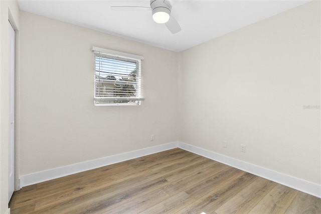 unfurnished room with hardwood / wood-style floors and ceiling fan