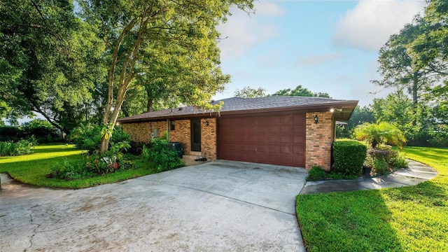 exterior space featuring a garage and a front yard