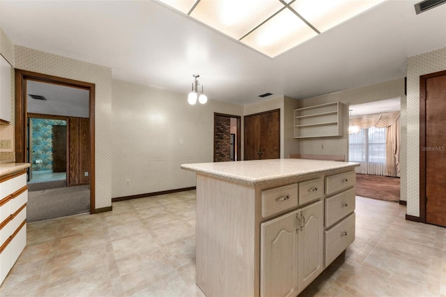 kitchen featuring a center island, an inviting chandelier, and decorative light fixtures