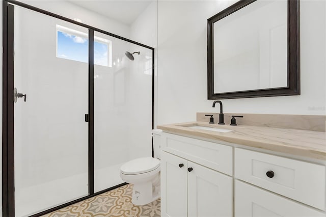 bathroom with an enclosed shower, vanity, and toilet