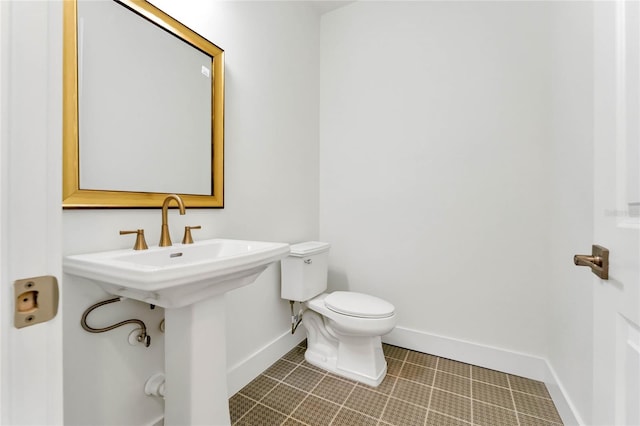 bathroom featuring tile patterned floors and toilet