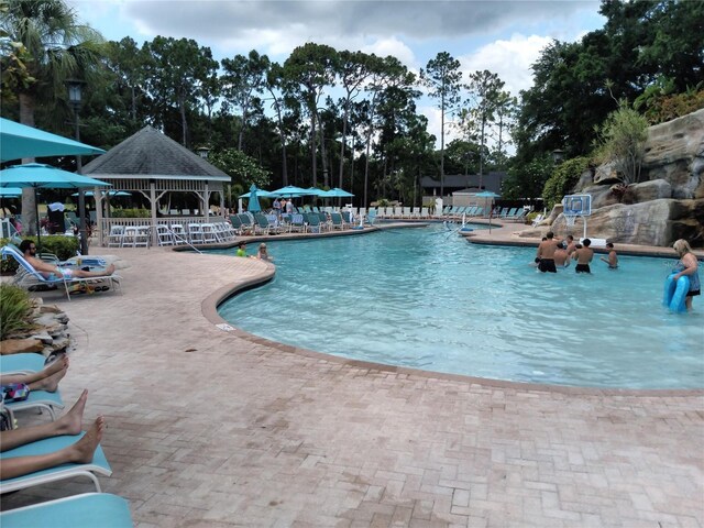 view of pool with a patio and a gazebo