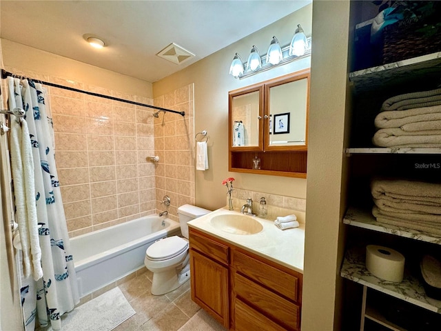 full bathroom with tile patterned floors, shower / bath combo, toilet, and vanity