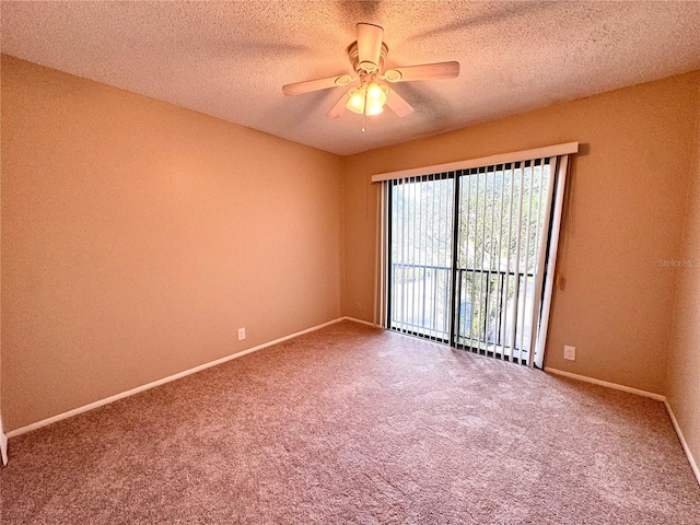 carpeted empty room featuring a textured ceiling and ceiling fan