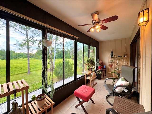 sunroom with a wealth of natural light and ceiling fan