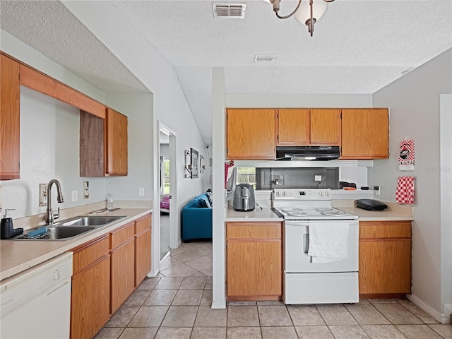 kitchen featuring light tile patterned floors, white appliances, sink, exhaust hood, and a textured ceiling