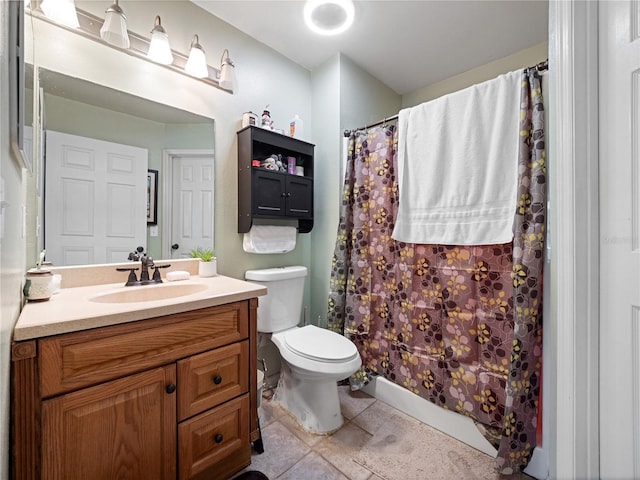 bathroom featuring vanity, toilet, a shower with curtain, and tile patterned floors