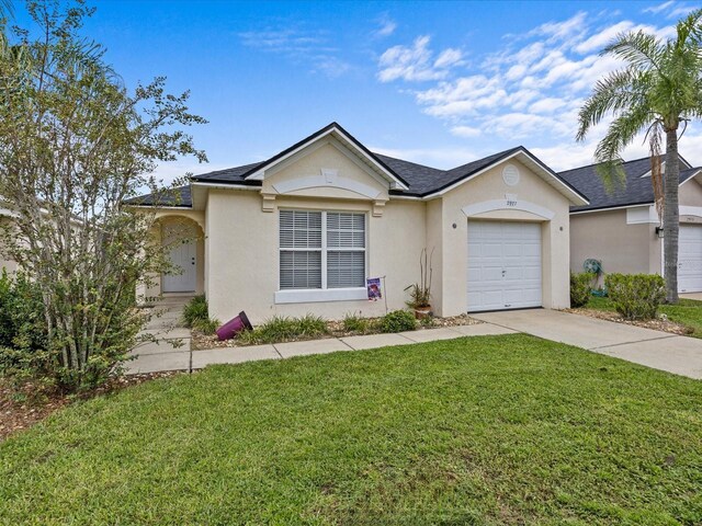 ranch-style house with a garage and a front lawn