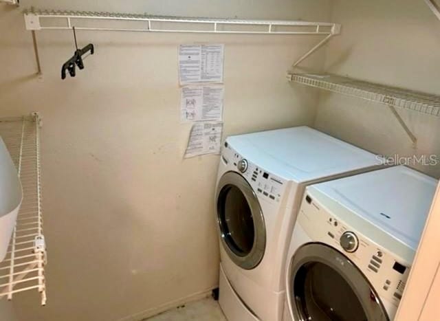 clothes washing area with washer and dryer