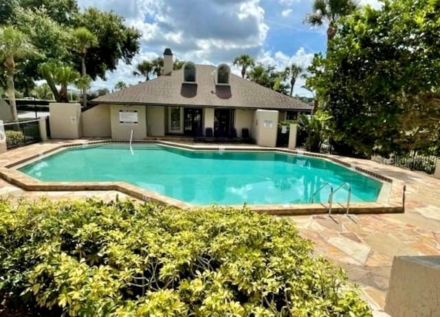 view of swimming pool featuring a patio