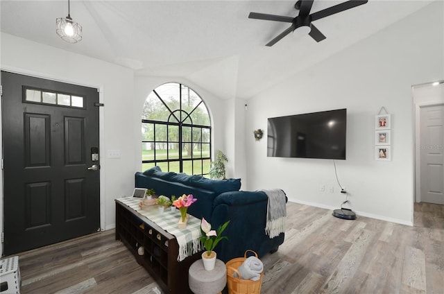 foyer entrance featuring high vaulted ceiling, hardwood / wood-style flooring, and ceiling fan