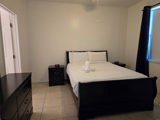 bedroom featuring light tile patterned floors