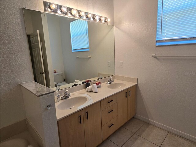 bathroom with vanity and tile patterned flooring