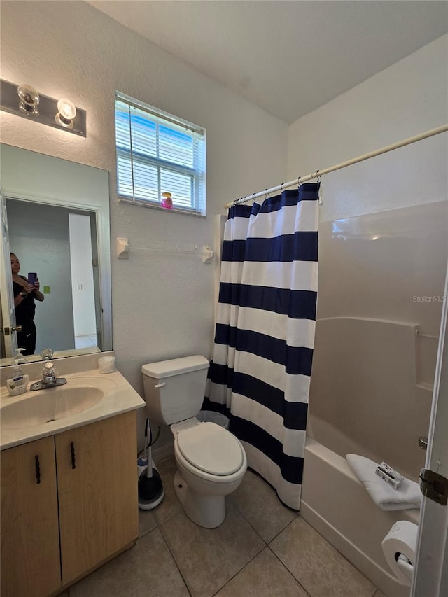 full bathroom with vanity, toilet, shower / bath combo, and tile patterned flooring